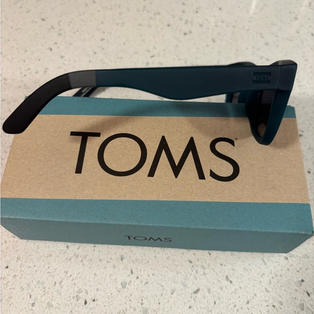 Toms brand Paloma Traveler sunglasses.